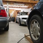 Three Vehicles in Shop