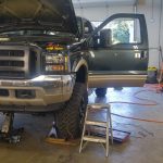 Hoisted Ford Truck in Shop